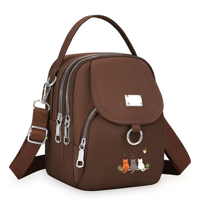 A Women'S Shoulder Bag Featuring a Cute Cat Design, Known As a Lucky Cat Bag, Believed to Bring Fortune to Its Owner, Made from High-Quality Nylon And Fabric