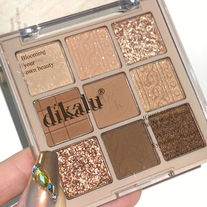 A 9-Color Eyeshadow Palette Featuring Low-Saturation Matte And Shimmer Velvet Textures in Earthy Tones, Taro, Milk Tea, And Powdery Purple Shades That Are Waterproof And Long-Lasting Without Smudging