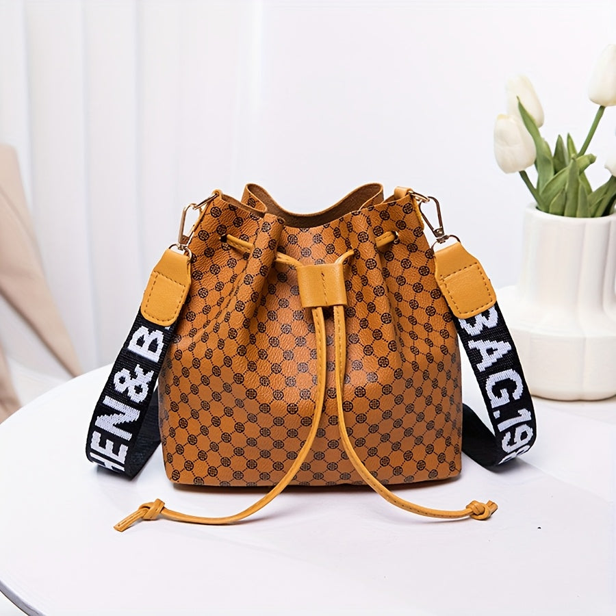A Stylish Bucket Bag with Random Prints, Featuring a Large Capacity, Drawstring Closure, And Perfect for Commuting, Ideal for a Trendy Shoulder Or Crossbody Look