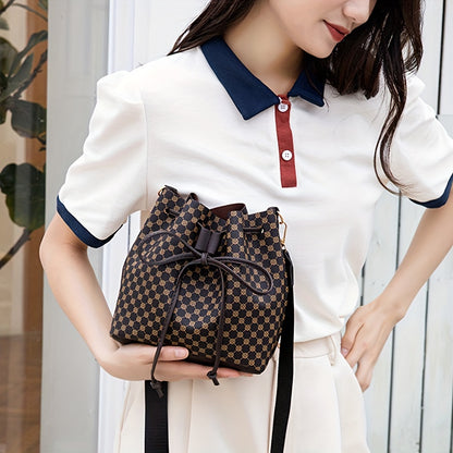 A Stylish Bucket Bag with Random Prints, Featuring a Large Capacity, Drawstring Closure, And Perfect for Commuting, Ideal for a Trendy Shoulder Or Crossbody Look
