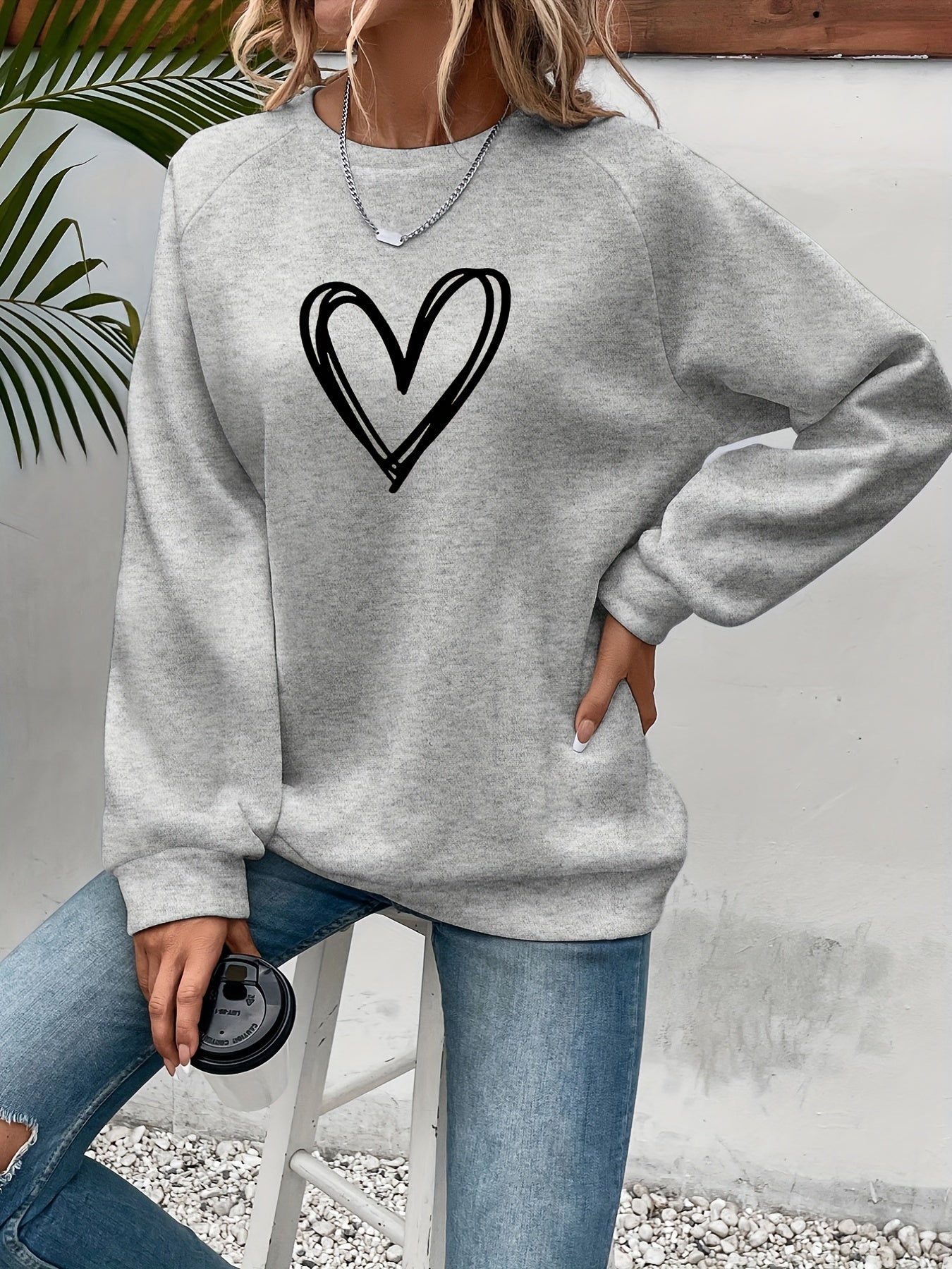 Cozy Fleece-Lined Women's Heart Print Sweatshirt - Casual Long Sleeve Crew Neck Pullover, Perfect for Fall & Winter, Machine Washable, Grey with Black Heart Design
