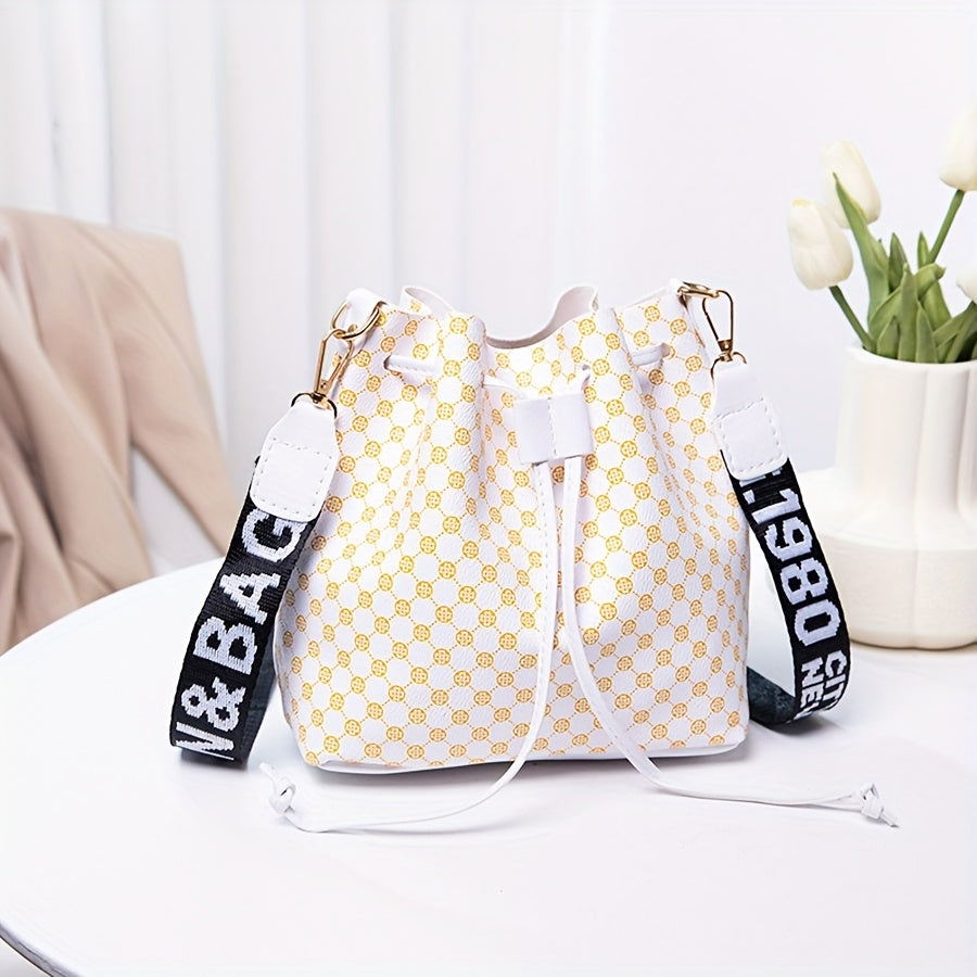 A Stylish Bucket Bag with Random Prints, Featuring a Large Capacity, Drawstring Closure, And Perfect for Commuting, Ideal for a Trendy Shoulder Or Crossbody Look
